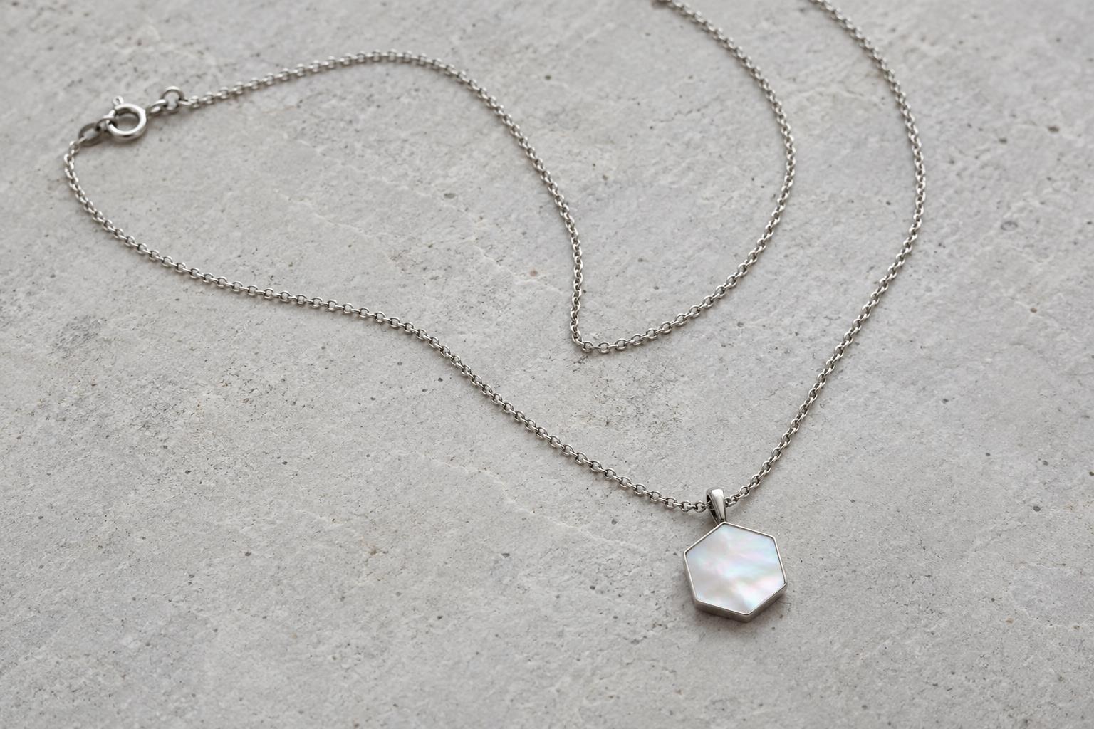 Shell & steel pendant — styling illustration